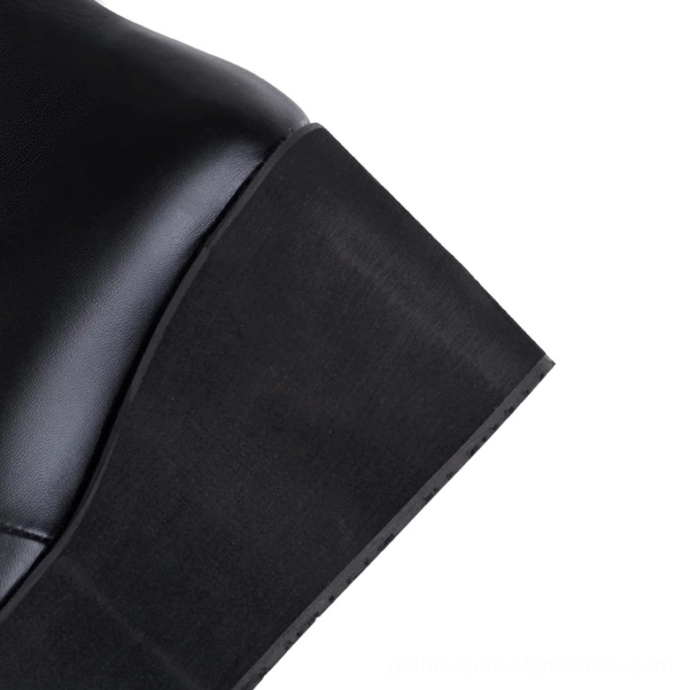 Gothic black platform boots heel section showing matte leather shaft and thick sole