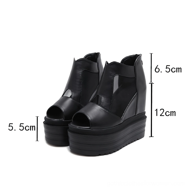 Women's black platform ankle boots with measurement markers showing 12cm hidden wedge heel and 5.5cm front platform