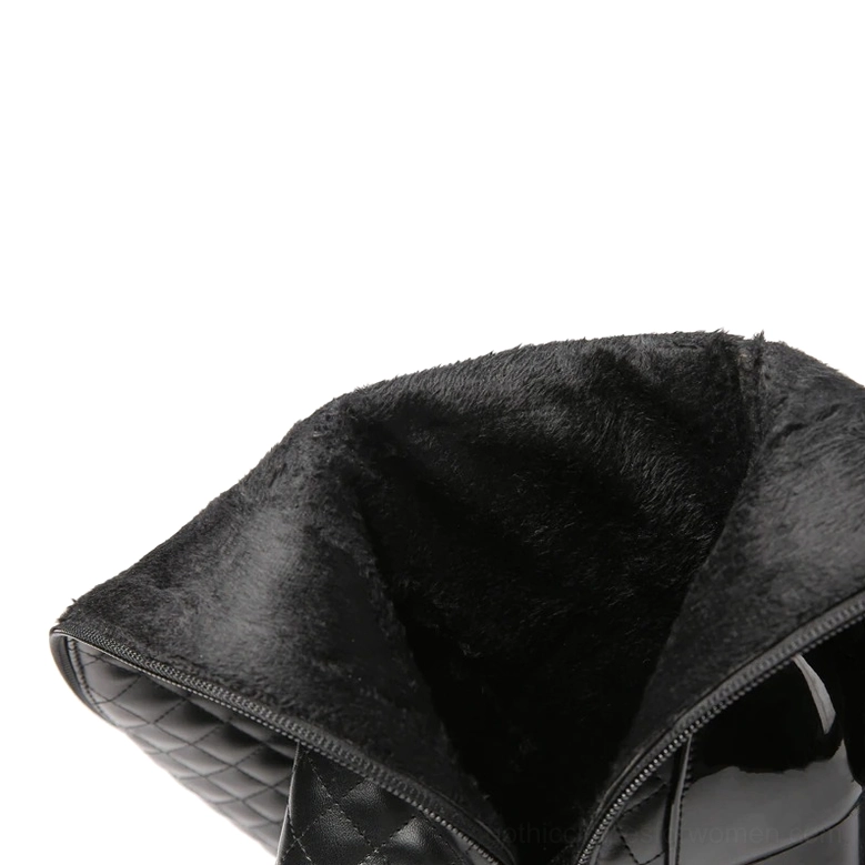 Interior lining of black quilted gothic boots showing warm plush fabric and side zipper