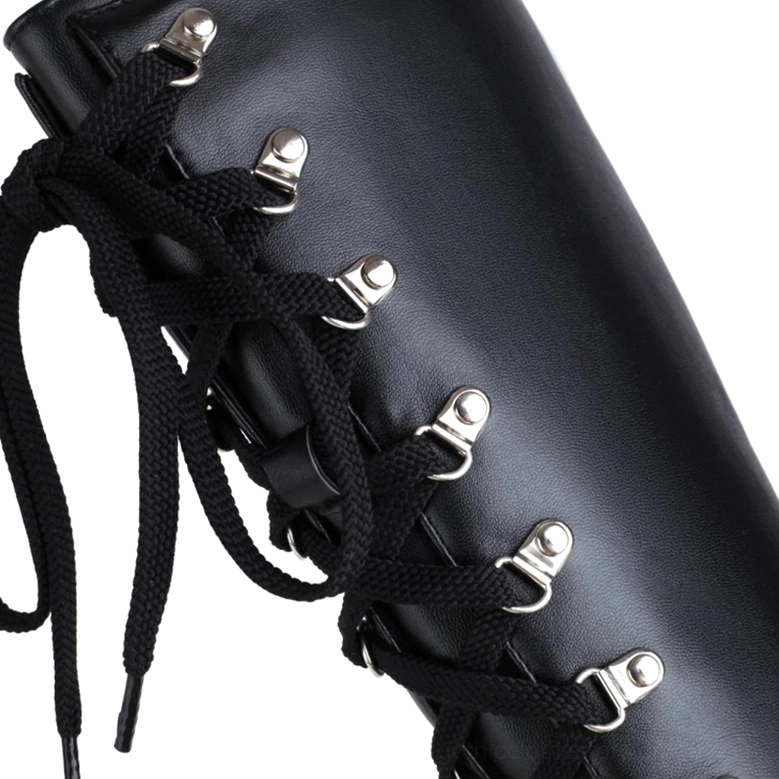Gothic platform boots close-up showing metal lace eyelets and smooth black leather