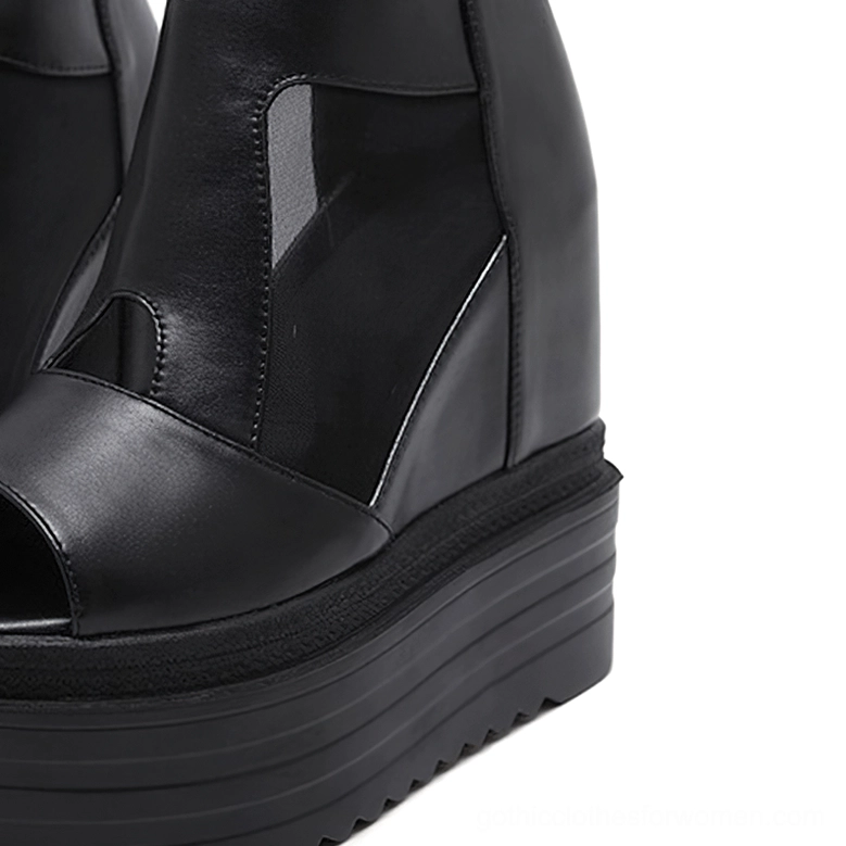 Bottom sole view of black gothic platform boots showing textured non-slip rubber outsole