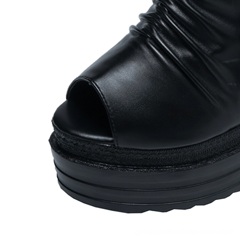 Close-up of gothic platform boots peep toe and thick rubber sole from above