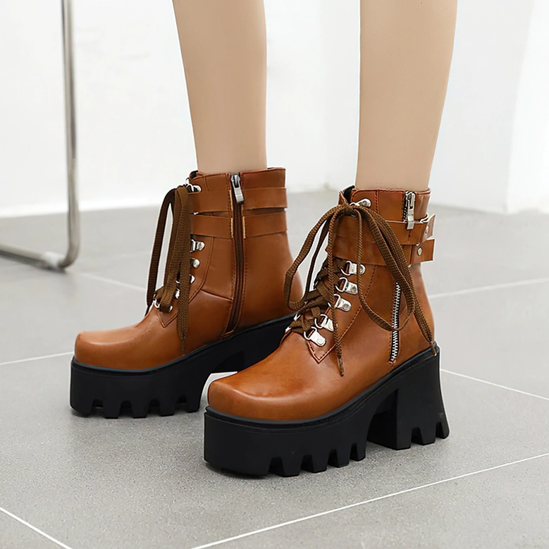 Gothic platform boots detail view emphasizing the side zipper mechanism and lace-up front combined closure system