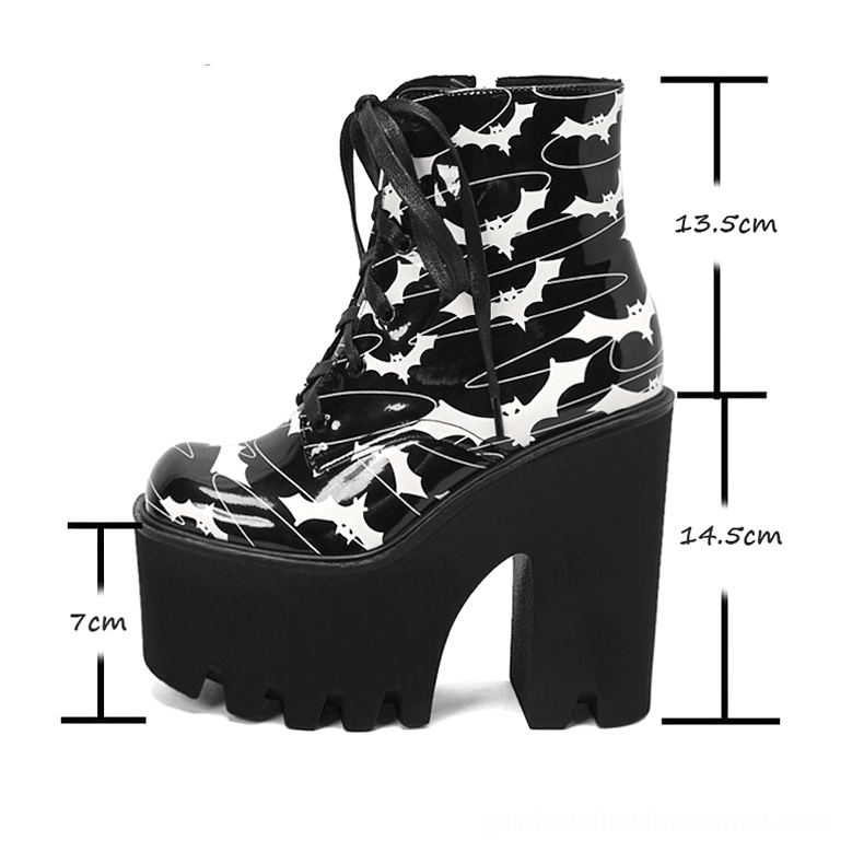 Black gothic platform ankle boots with bat print design displaying height specifications and measurements, left profile angle on white background