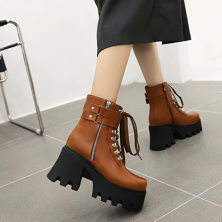 Gothic platform boots showcasing the super high square heel and substantial platform height, engineering-focused detail view