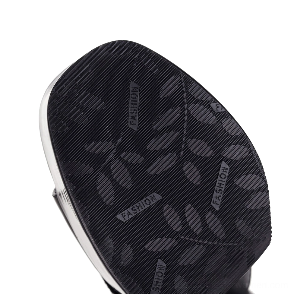 Bottom view of gothic platform heel showing textured rubber outsole with tread pattern for grip and stability