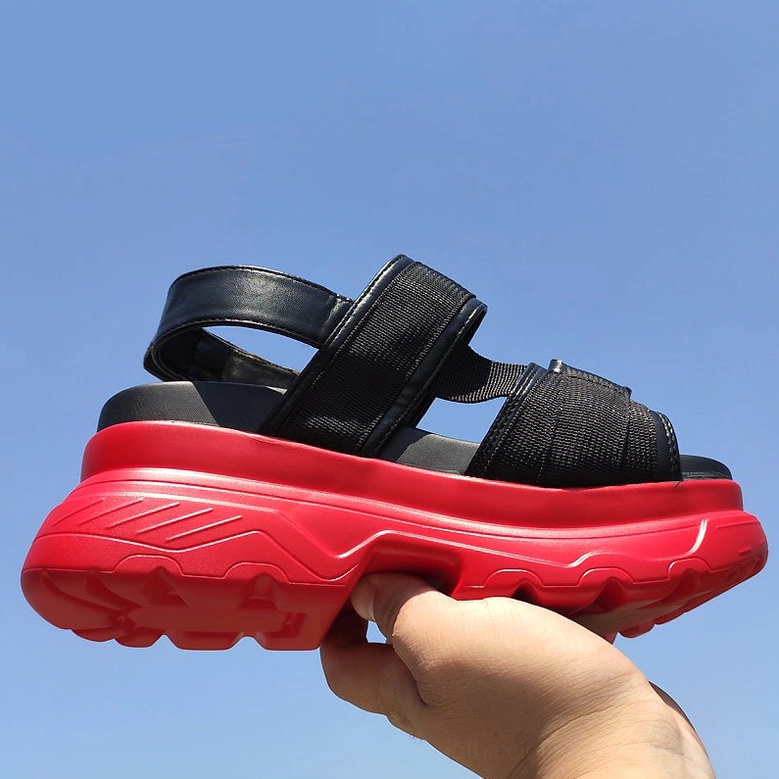 Black and red platform sandal lateral side view showing open heel design and textured tread