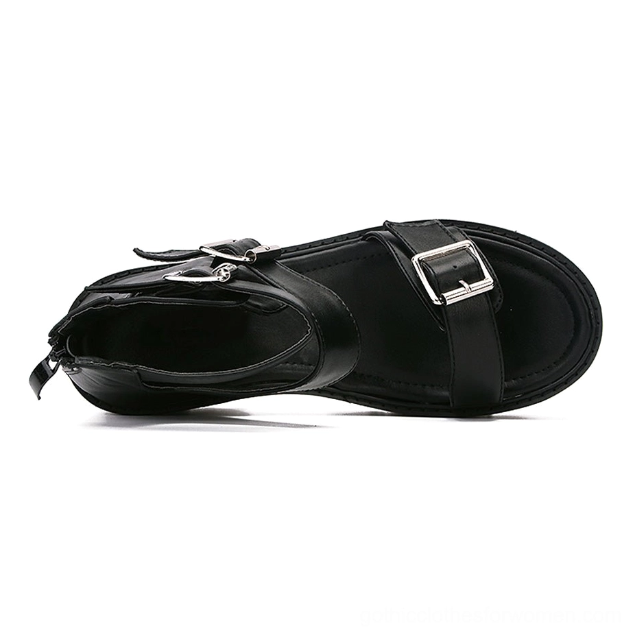 Single black gothic platform sandal top-down interior view displaying ankle zipper and metal buckle hardware