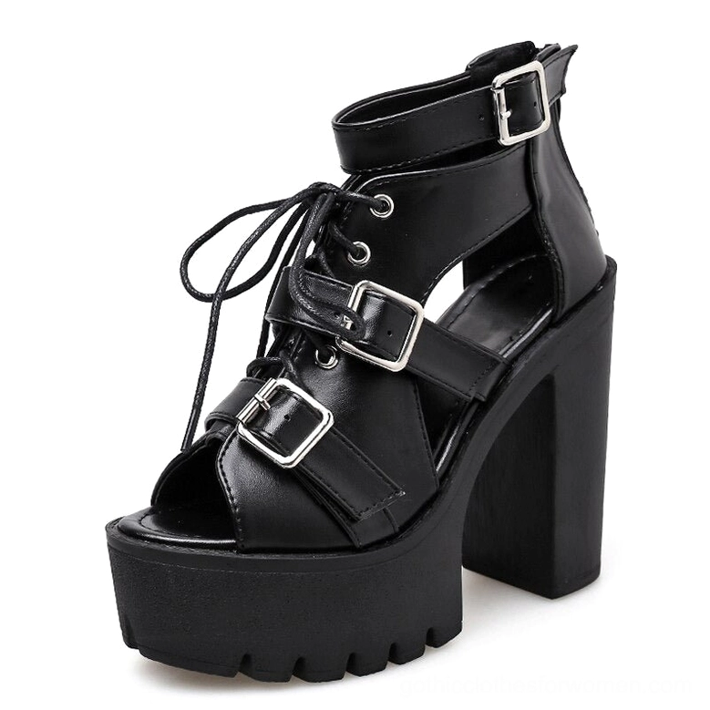 Black gothic platform sandals front three-quarter view showing lace-up front closure and silver buckle straps, open-toe design