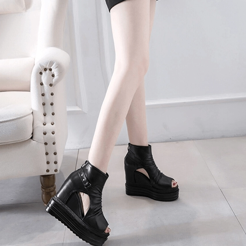 Gothic platform wedge boots full side view on model showing 12cm heel and smooth leather upper