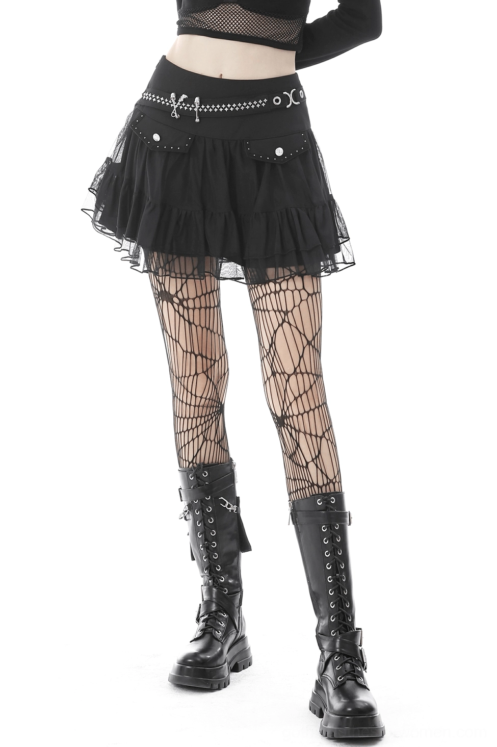 Black gothic pleated mini skirt with skull chain waistband and star studs, three-quarter side view on model