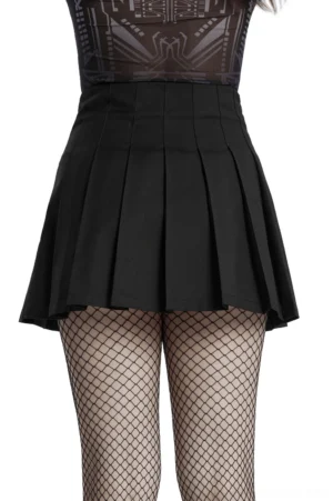 Gothic pleated skirt rear view on model wearing dark fishnet stockings, back lower-body angle