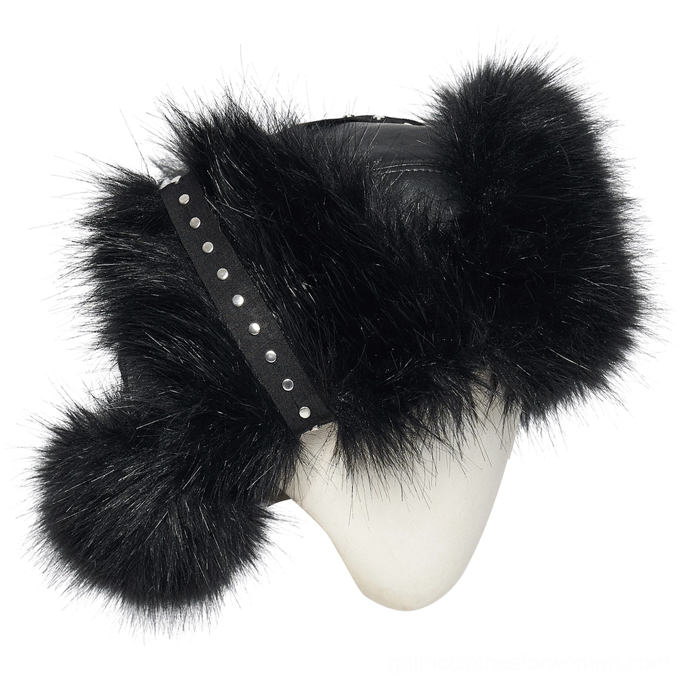 Side three-quarter view of gothic plush trapper hat with studded leather strap and fur pom-pom ear flap