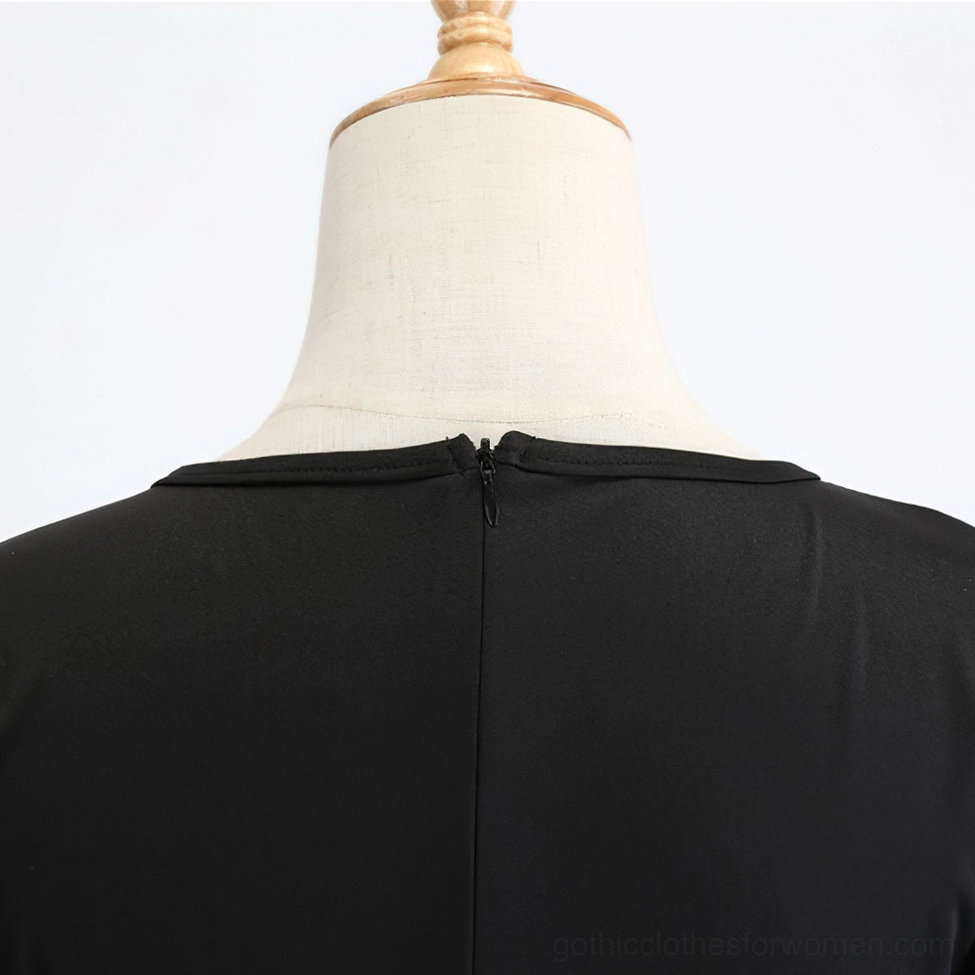 Back view of black gothic pumpkin print dress showing flared skirt and sleeve detail