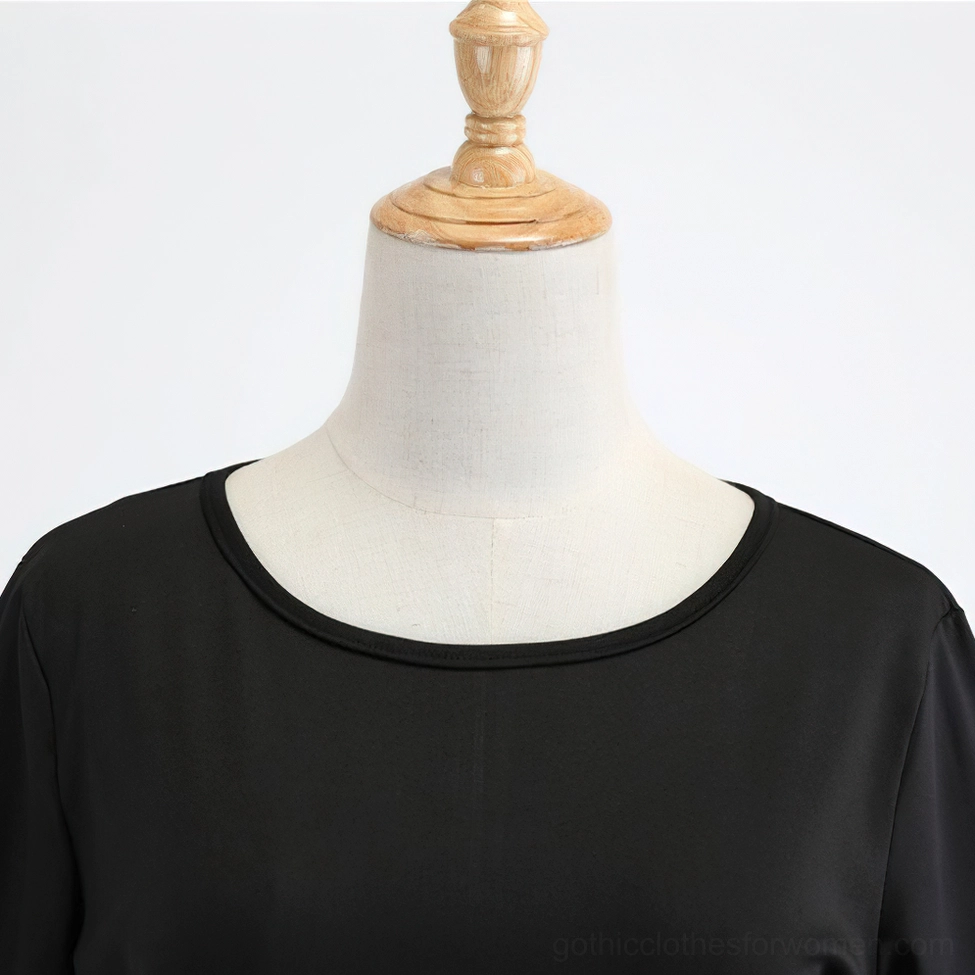 Black gothic pumpkin dress side profile showcasing A-line silhouette and waist cinch