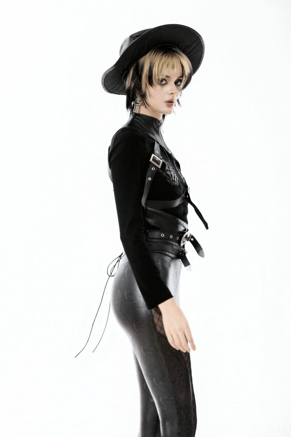 Overhead flat lay of asymmetric shoulder cape showing overall design and leather texture
