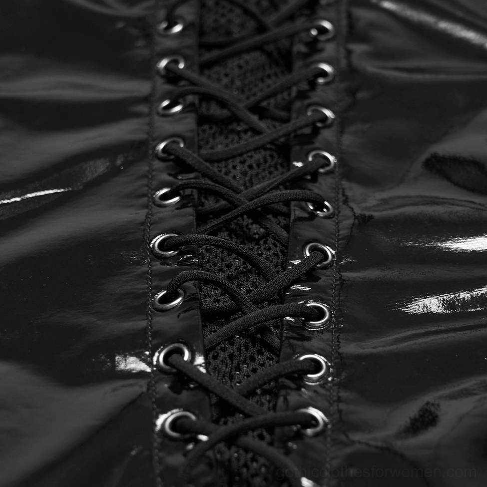 Close-up flat lay of black gothic punk dress lace-up front showing metal eyelets and black lace cords on patent leather