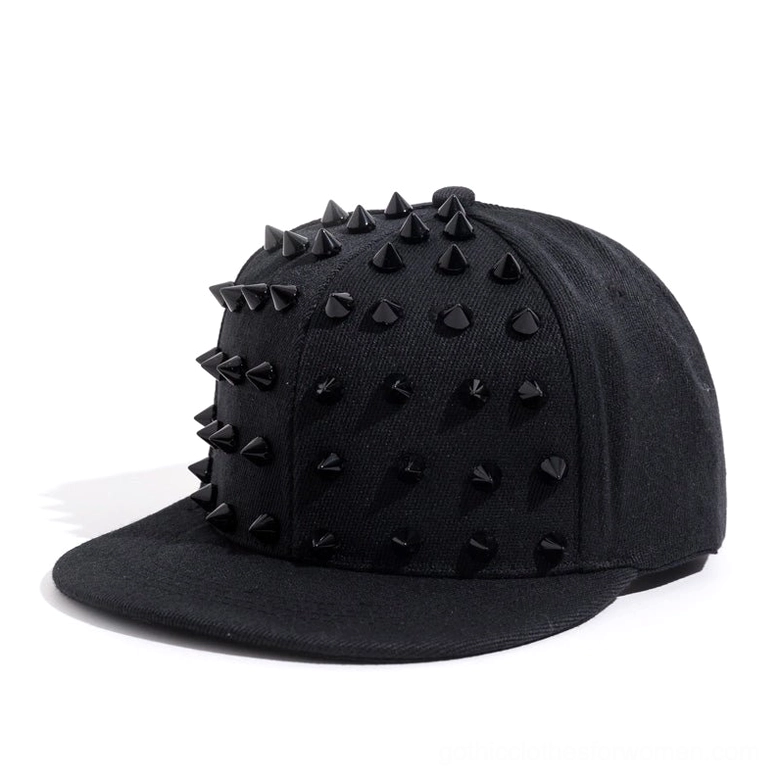 All-black studded snapback cap with black metal cone spikes, front three-quarter view