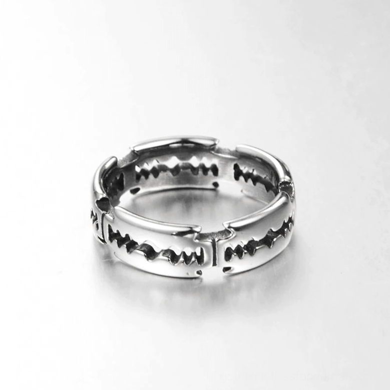 Top-down flat view of stainless steel blade ring with hollowed sawtooth texture pattern, silver metal material