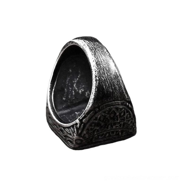 Vintage biker ring inner band showing aged black metal finish with intricate engraved floral gothic ornaments
