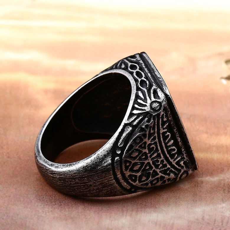 Gothic ring shank detail showing intricate carved floral ornaments on interior band, close-up view