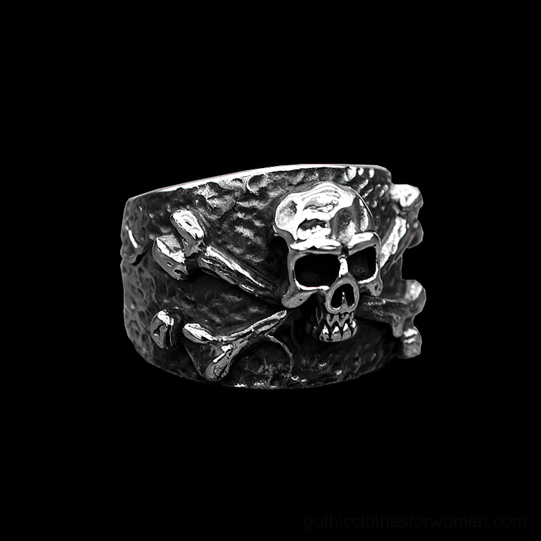 Dark aged silver stainless steel gothic skull ring side-front angle with rough hammered finish on black background