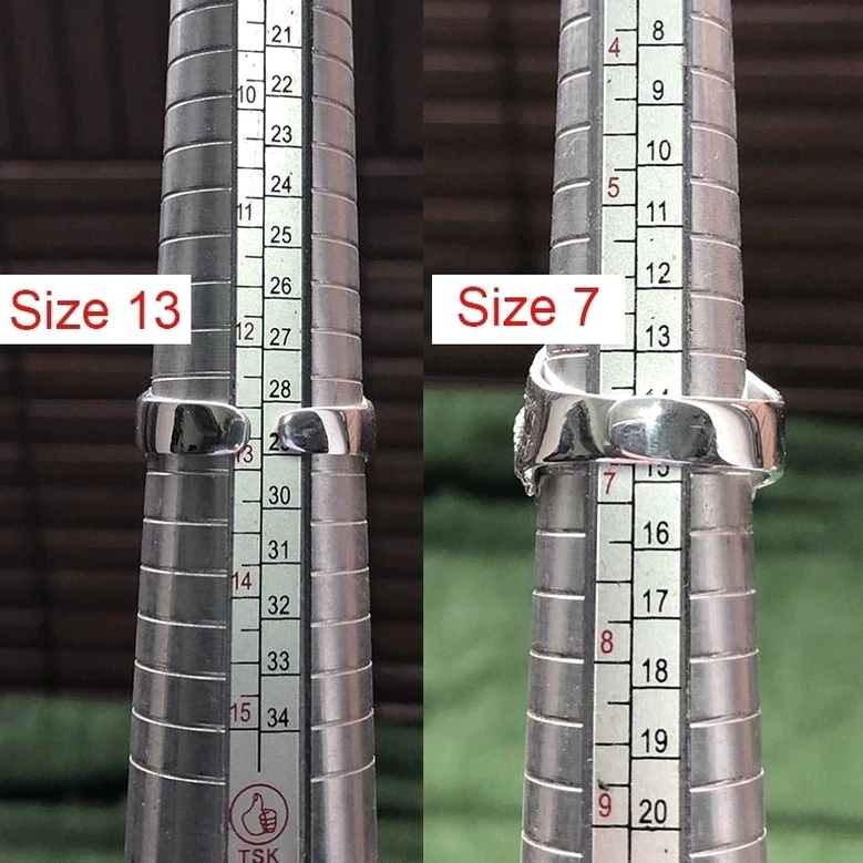 Adjustable gothic skull ring sizing calibration with ring gauge showing size 7 and size 13 freesize fit demonstration