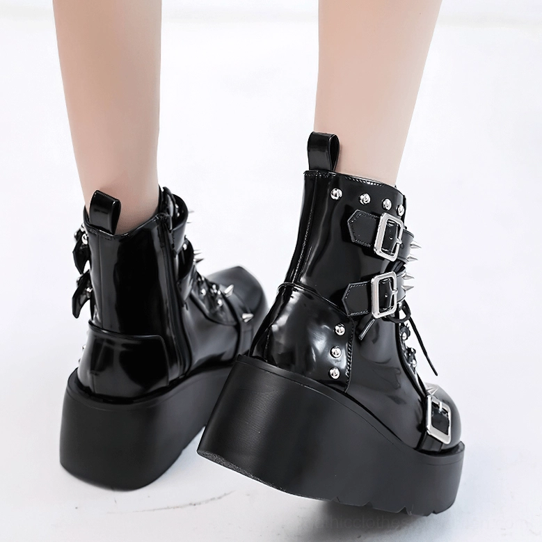 Gothic riveted platform ankle boots for women showcasing punk buckle hardware