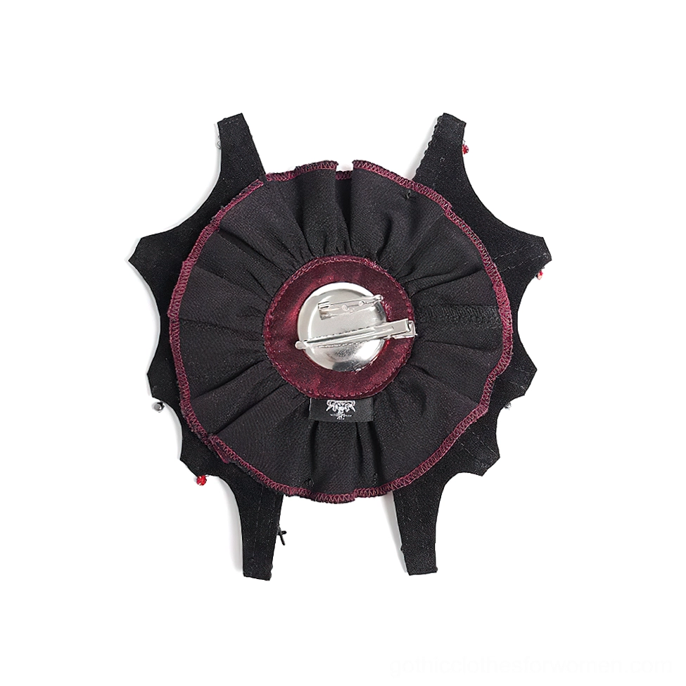 Rear close-up view of black gothic hair clip showing secure fastening mechanism and burgundy edging detail against white background