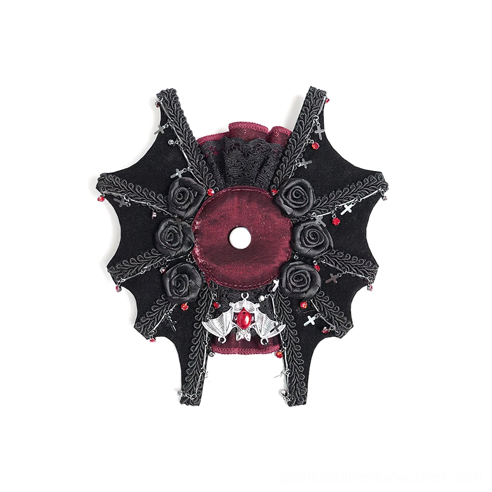 Flat lay front view of black gothic rose cross hair clip with burgundy center, cross charm, and spiderweb lace detailing against white background