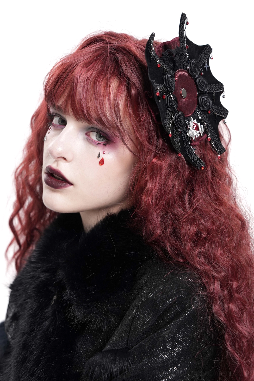 Black gothic hair clip with rose cross and spiderweb pattern displayed on model's right side, featuring intricate lace trim and skull charm