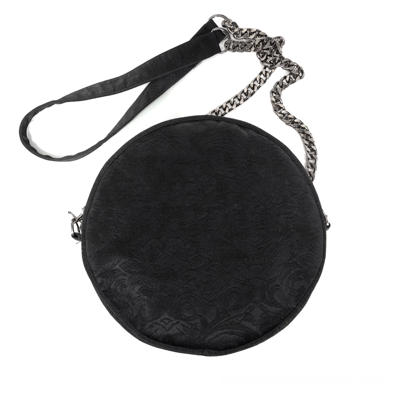 Back view of gothic round bag showing plain black jacquard fabric, metal zipper closure, and strap hardware attachment