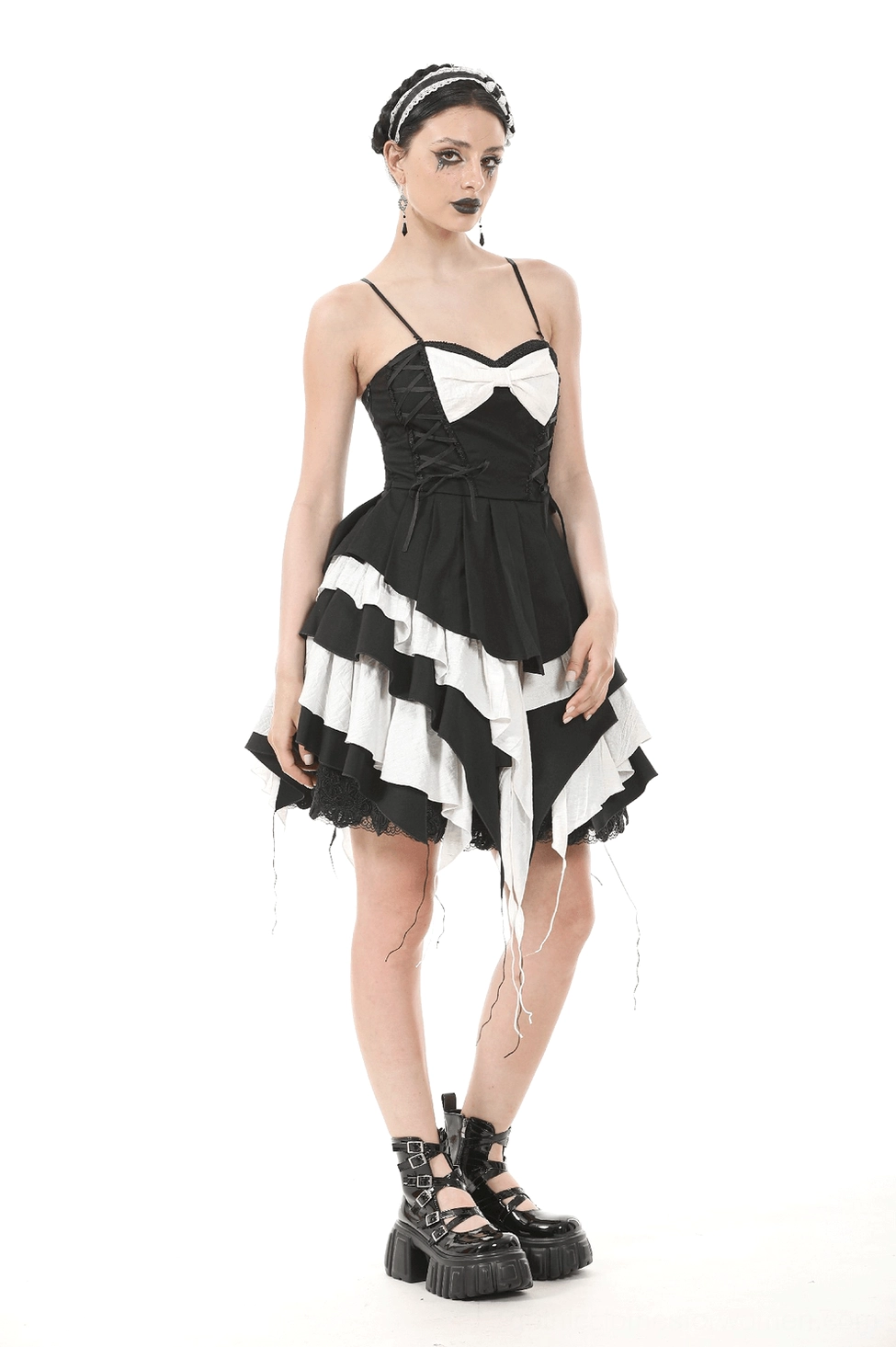 Black and white tiered gothic dress showing ruffled texture and construction on model