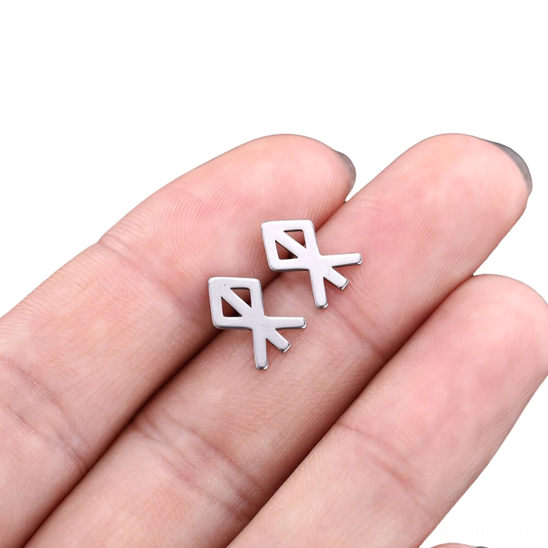 Gothic rune stud earring closeup, polished silver stainless steel with symbolic hollow design