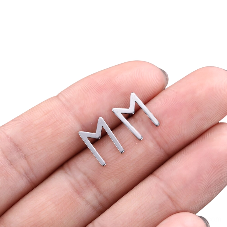 Gothic rune stud earring design detail, silver-toned stainless steel with precision craftsmanship