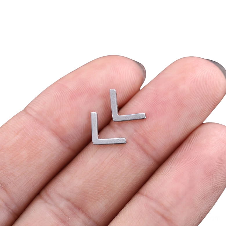Minimalist gothic rune stud earring collection view, multiple silver stainless steel designs showcasing variety