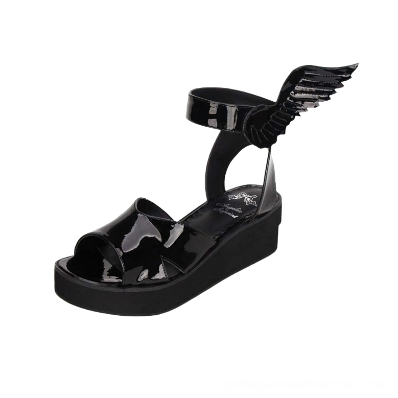 Single black winged platform sandal side view featuring patent finish, wing ankle decoration, and commanding platform sole