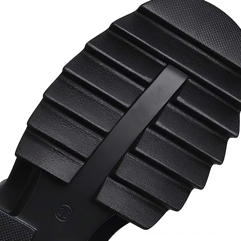 Black gothic sandal chunky rubber lug outsole top-down view with branded sole print
