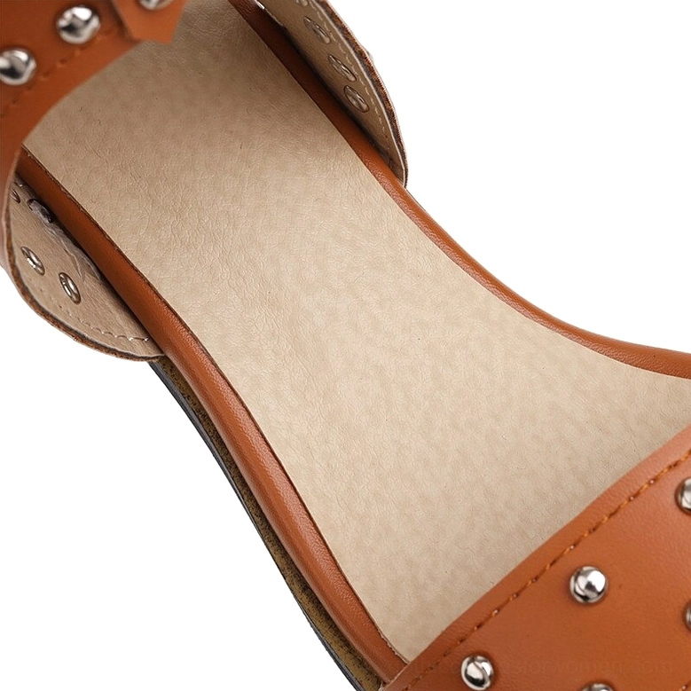 Interior view of gothic sandals showing tan PU leather insole and rivet-adorned brown leather upper