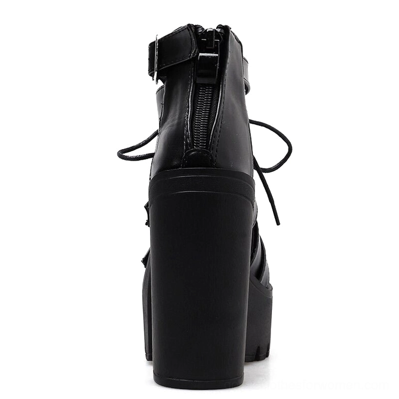 Rear view of black gothic platform sandals showing hidden rear zipper and thick block heel construction