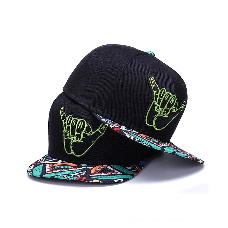 Gothic shaka hand snapback caps flat lay display showing black cotton construction with green embroidery and geometric printed brims