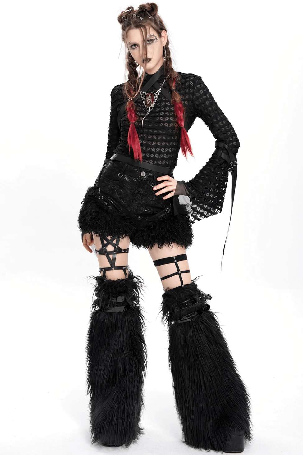 Bottom hem detail of black gothic shorts featuring luxurious faux fur trim and stitching construction