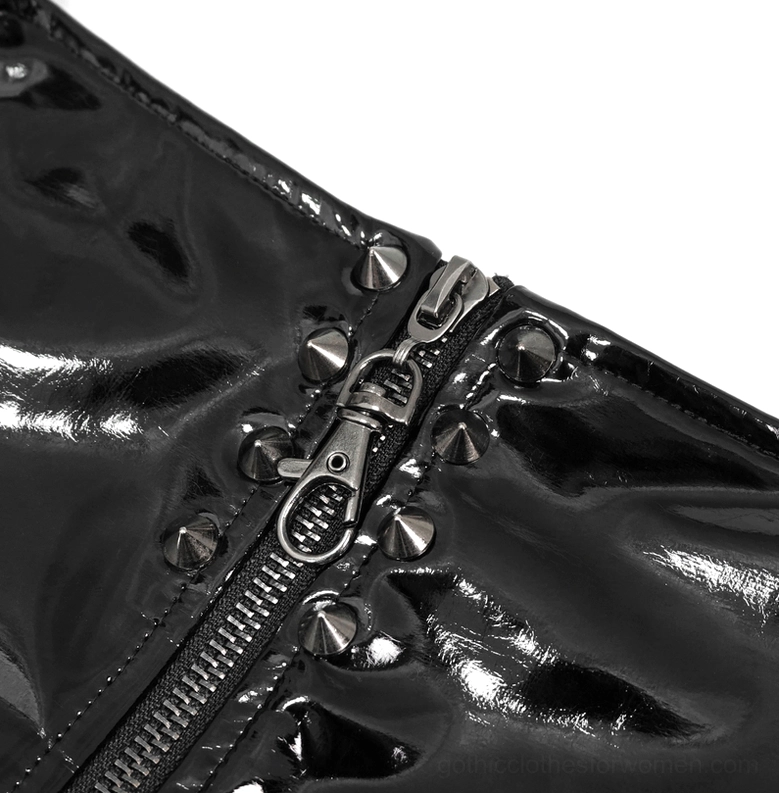 Detailed view of chain harness and waist hardware on women's black gothic leather shorts