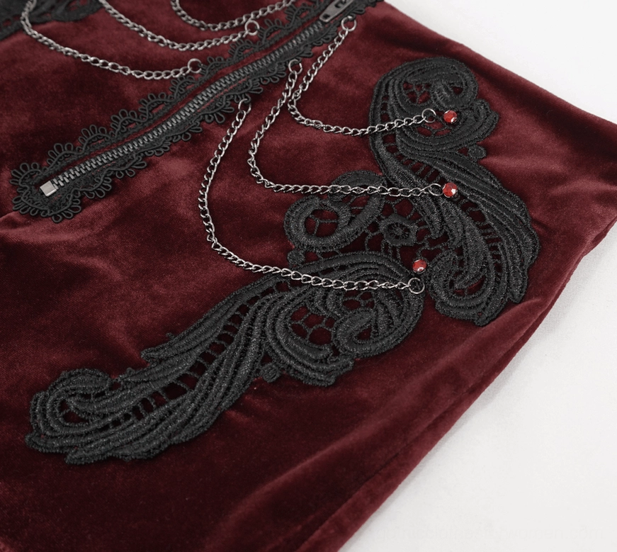 Top-down close-up of wine red gothic shorts front showing metal chains, black lace, and red gem accents