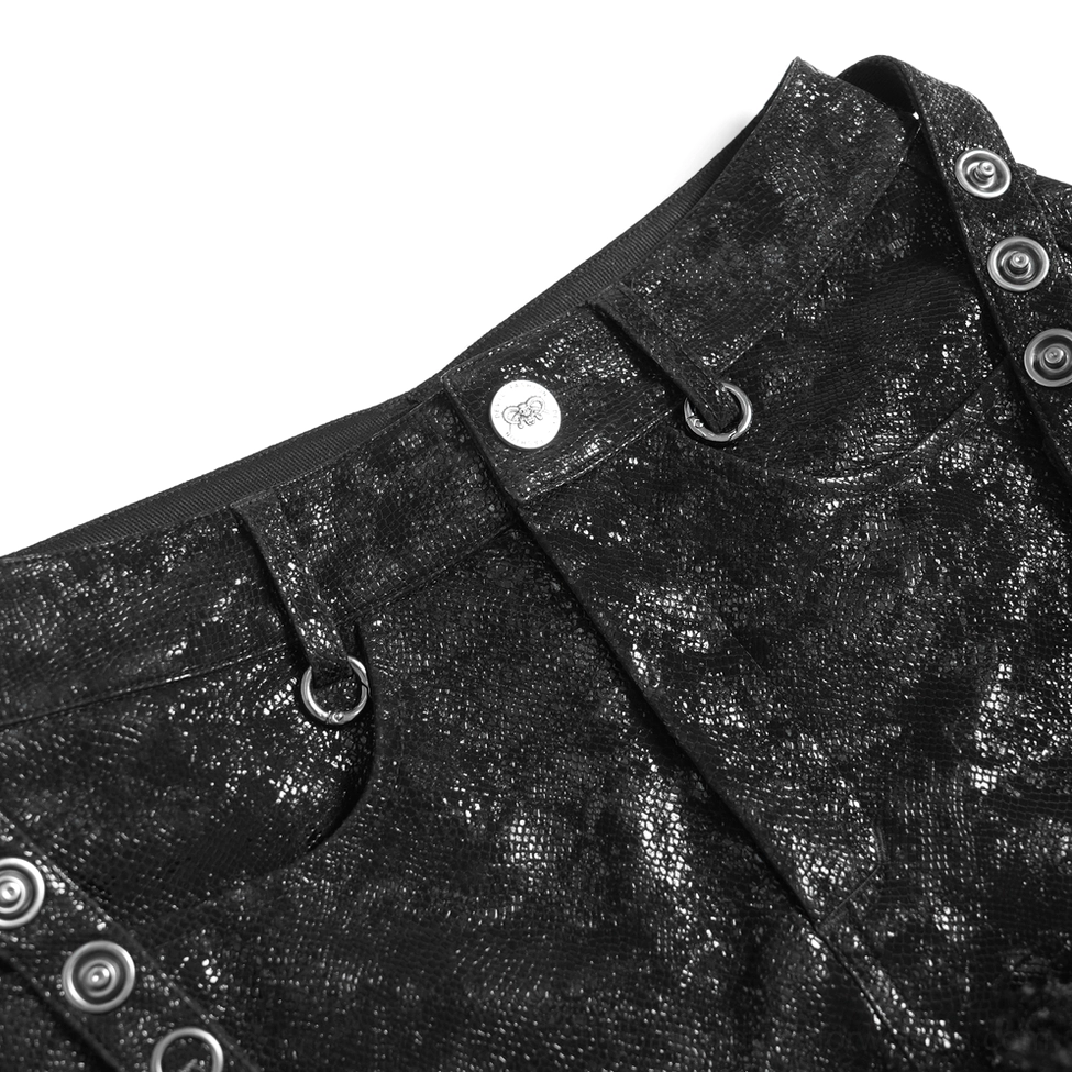 Detailed close-up of black faux leather material showing textured crackled surface finish on gothic shorts