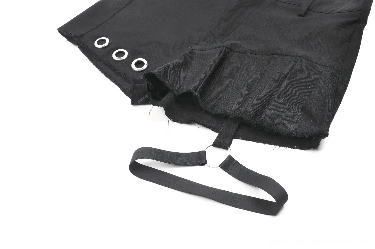 Full length view of model wearing asymmetrical black gothic pleated shorts and alternative accessories