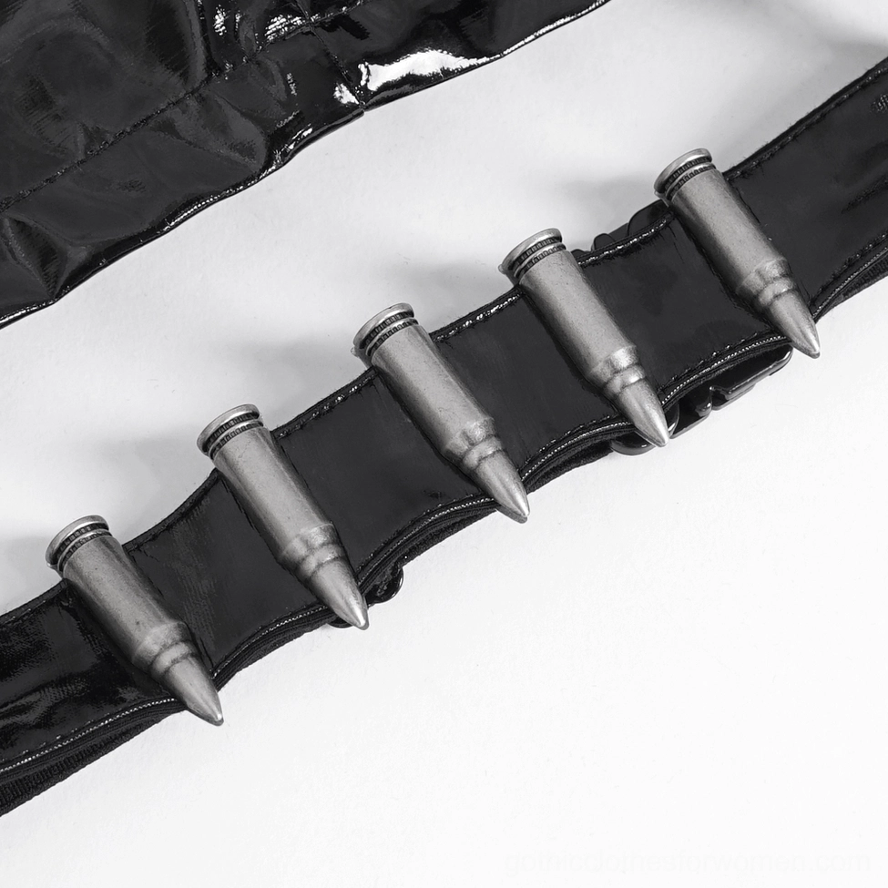 Close-up detail of punk style decorative belt attachment with bullet-shaped metal ornaments on black leather