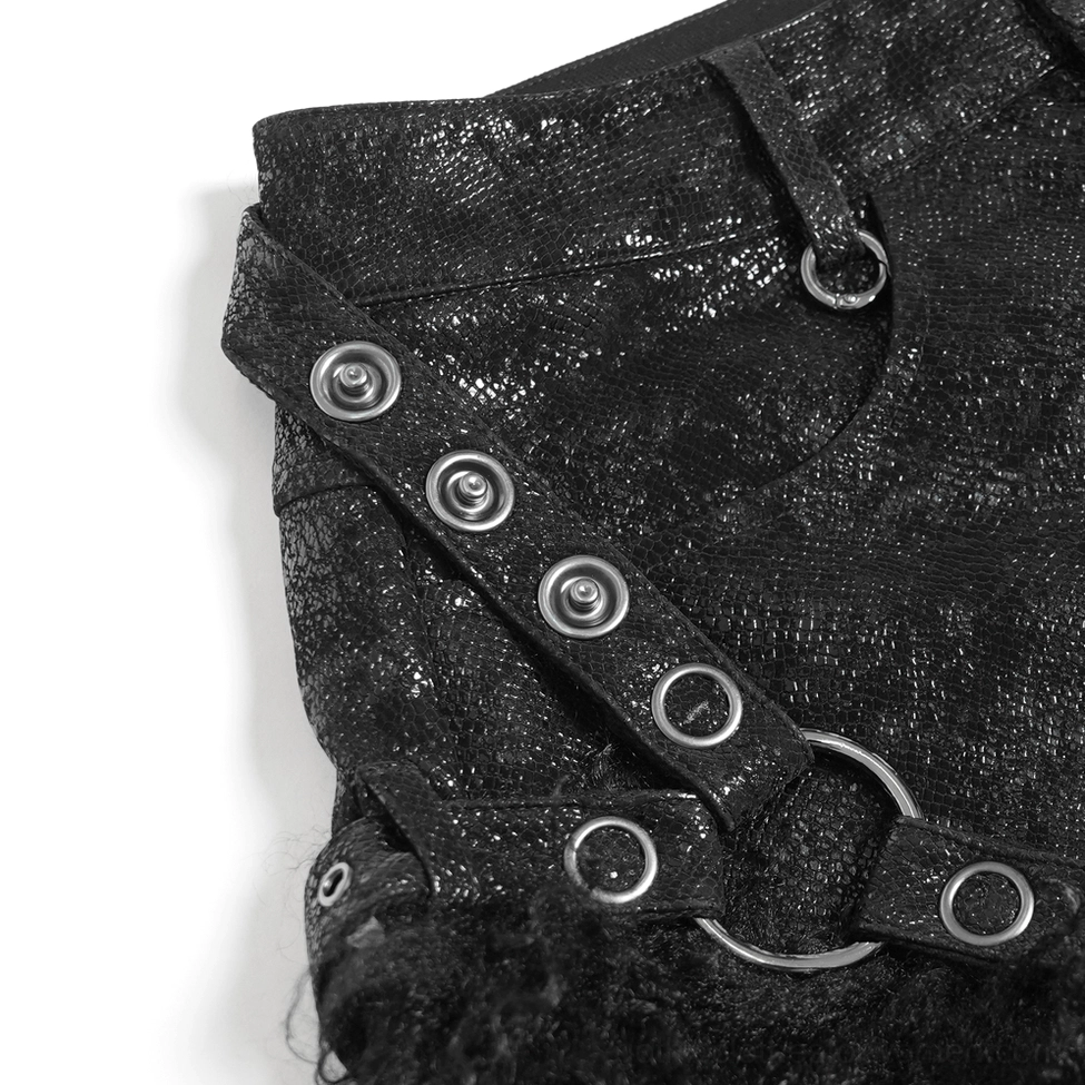 Hardware detail of gothic black shorts showing metal snap buttons, D-rings and branded waist button