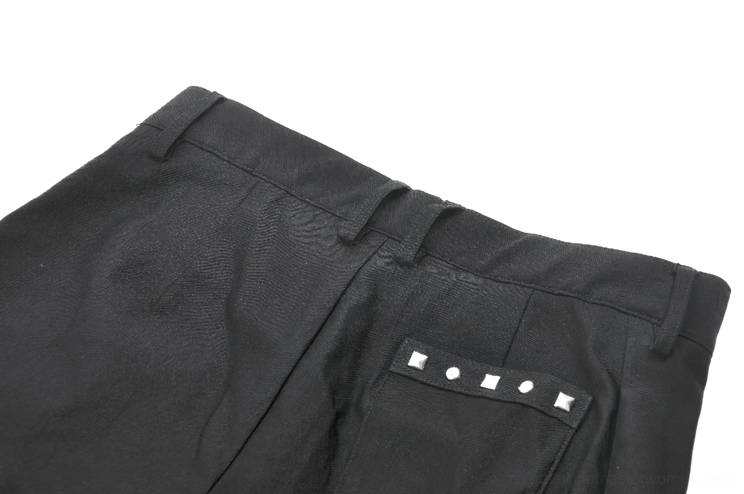 Detailed view of black gothic shorts O-ring thigh strap attachment point and industrial hardware