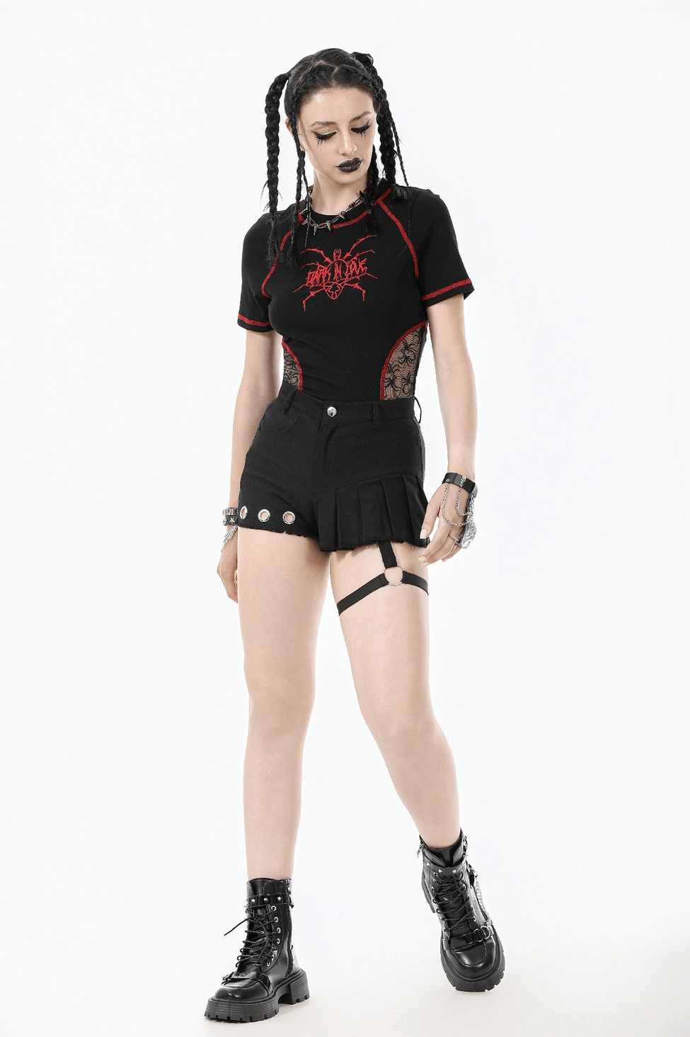 Detail shot of black gothic shorts back pocket studded design and raw hem construction